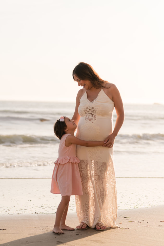 mom and daughter at the beach with their Morro Bay photographer